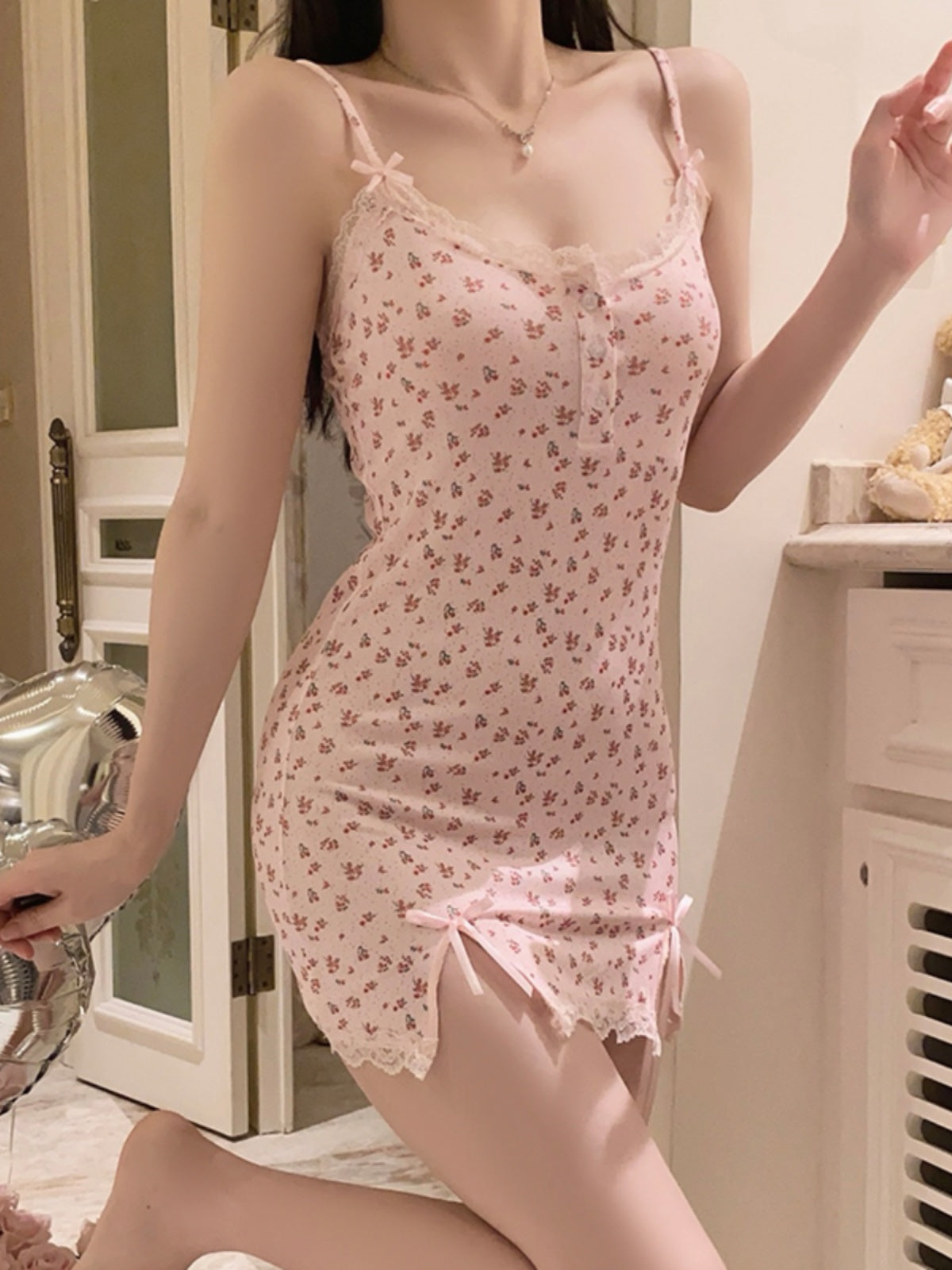 Charming and Sweet: Pink Mini Cami Dress with Delicate Floral Print, Lace - Trimmed Heart - shaped Neckline, and Bow - adorned Side Slits
