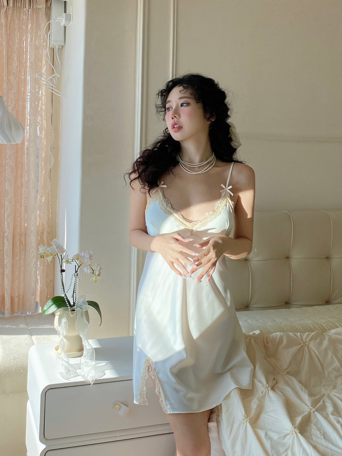 Sexy pajamas for women in spring and summer new style high-end ice silk thin solid color slit with chest pad suspenders nightgown
