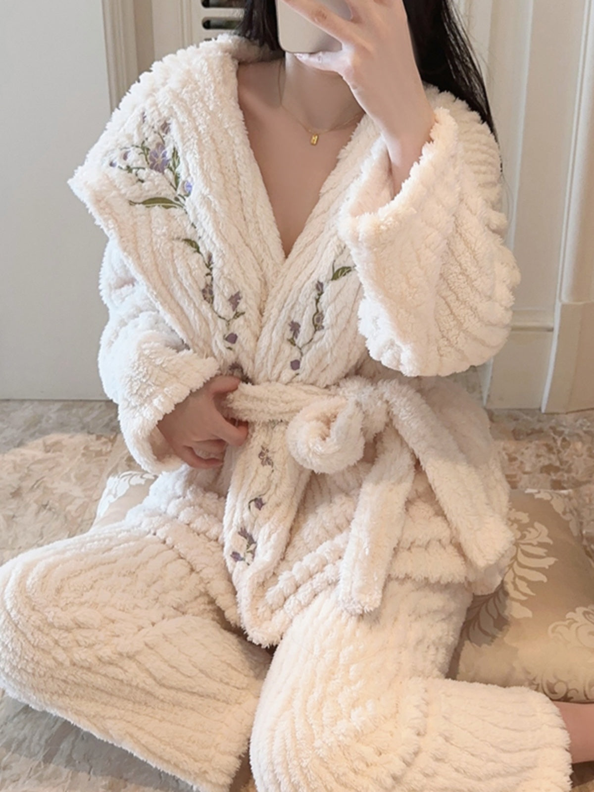 Cozy and Elegant: Cream - Hued Fleece Pajama Ensemble with Delicate Purple Floral Embroidery, Hooded V - neck Top, and Matching Textured Pants